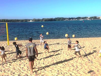 AICOL holiday kids practicing volleyball